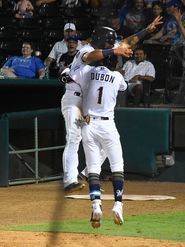 Jacob Nottingham celebrates after scoring the winning run. The Missions scored three runs in the ninth inning to beat the Iowa Cubs 4-3 on Tuesday at Wolff Stadium. - photo by Joe Alexander