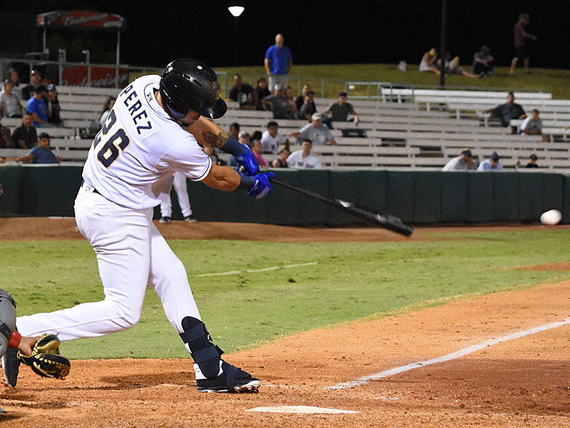 The Missions' Hernan Perez connects with the ball for the winning hit in the 12th inning Saturday night at Wolff Stadium. - photo by Joe Alexander