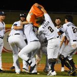 The Missions celebrate after Hernan Perez's walk-off hit in the 12th inning Saturday night at Wolff Stadium. - photo by Joe Alexander