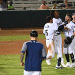 The Missions celebrate after Blake Allemand drove in Jacob Nottingham with the winning run in the 10th inning Friday at Wolff Stadium. - photo by Joe Alexander