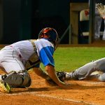 Flying Chanclas catcher Tyler LaRue tags out a Hairy Men runner at the plate on Friday night at Wolff Stadium. - photo by Joe Alexander