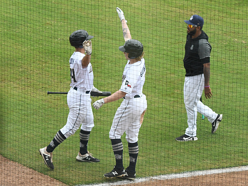 The San Antonio Missions' Jack Suwinski (center) celebrates after hitting a ninth-inning home run against the Frisco RoughRiders on Sunday at Wolff Stadium. - photo by Joe Alexander