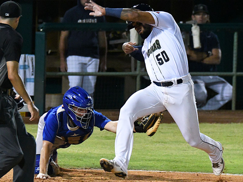 Allen Cordoba dodges a tag attempt by Midland RockHounds catcher JJ Schwarz to score the San Antonio Missions' final run in the bottom of the eighth inning on Wednesday at Wolff Stadium. - photo by Joe Alexander