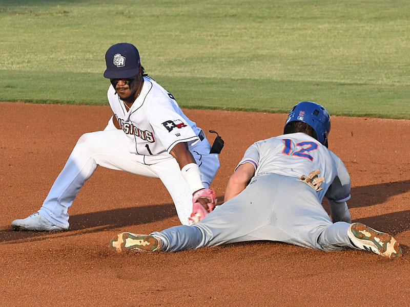 San Antonio Missions shortstop Eguy Rosario trying to tag out a Midland RockHounds base stealer on Friday at Wolff Stadium. - photo by Joe Alexander