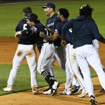 The Missions' Ethan Skender (7) celebrates with teammates after his walk-off hit in Wednesday's second game at Wolff Stadium. - photo by Joe Alexander