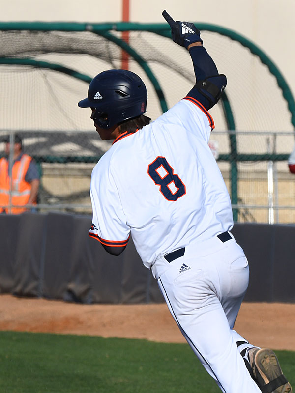 Leyton Barry sees his line drive fall in for a hit and Shane Sirdashney score from third in the last inning in UTSA's 6-5, 10-inning victory over No. 2 Stanford on Monday, Feb. 28, 2022 at Roadrunner Field. - photo by Joe Alexander