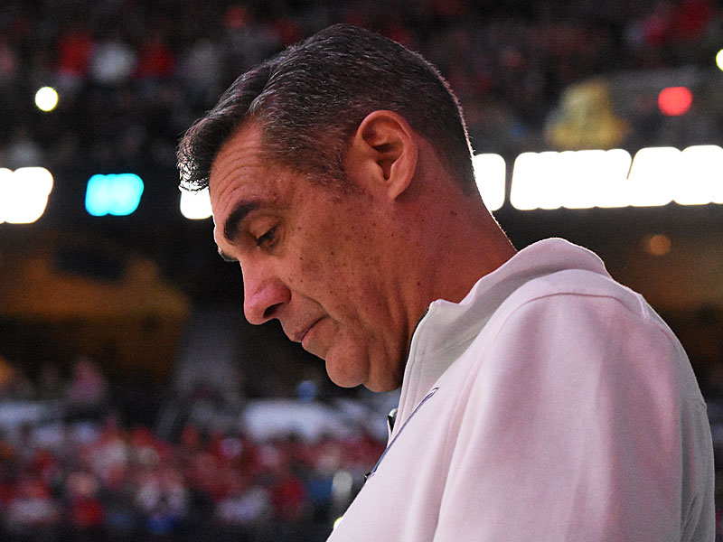 As the arena lights were turned down for the pregame introductions, Villanova coach Jay Wright was reading something he pulled from his pocket. I'd guess key points from his game plan or words of motivation or wisdom. I'll probably never know for sure. - photo by Joe Alexander