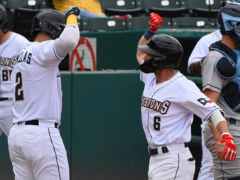 Tirso Ornelas (2) and Connor Hollis (6) celebrate at the plate after they both scored ono Hollis' home run in the first game. The San Antonio Missions beat the Corpus Christi Hooks 4-3 in the first game of a doubleheader on Saturday, May 13, 2023, at Wolff Stadium. - photo by Joe Alexander