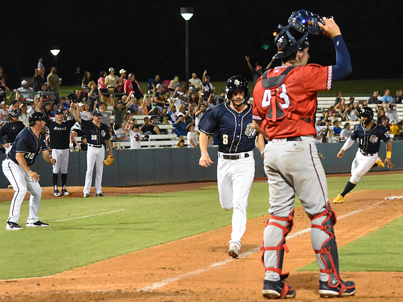 Connor Hollis scores and Ray-Patrick Didder (far right) rounds third as the Missions won on Tirso Ornelas' walk-off double. The San Antonio Missions beat the Wichita Wind Surge 6-5 on Tuesday, June 6, 2023, at Wolff Stadium. - photo by Joe Alexander