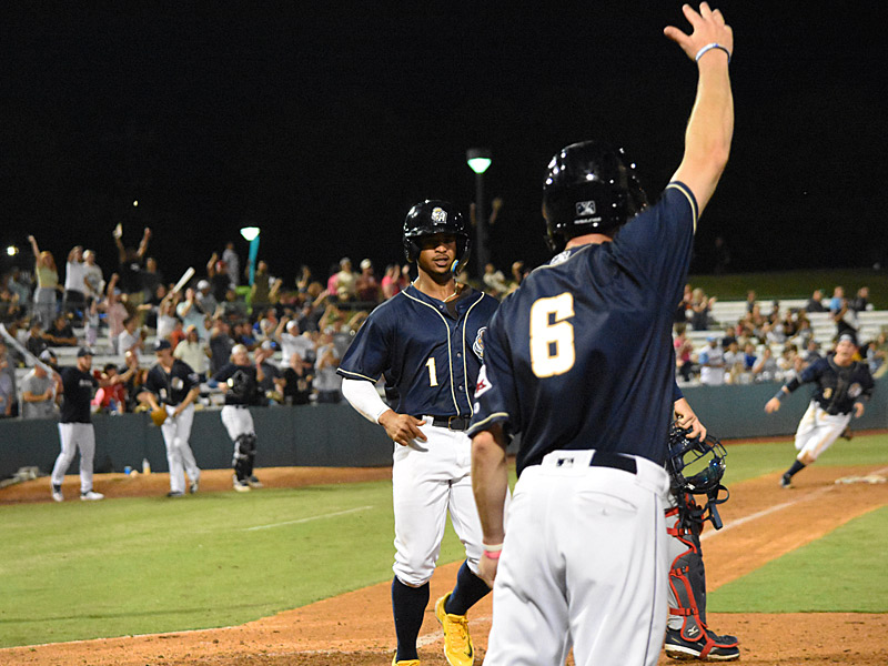 Ray-Patrick Didder crosses home with the run that tied the game and Ripken Reyes (far right) rounds third on Tirso Ornelas' walk-off double. The San Antonio Missions beat the Wichita Wind Surge 6-5 on Tuesday, June 6, 2023, at Wolff Stadium. - photo by Joe Alexander