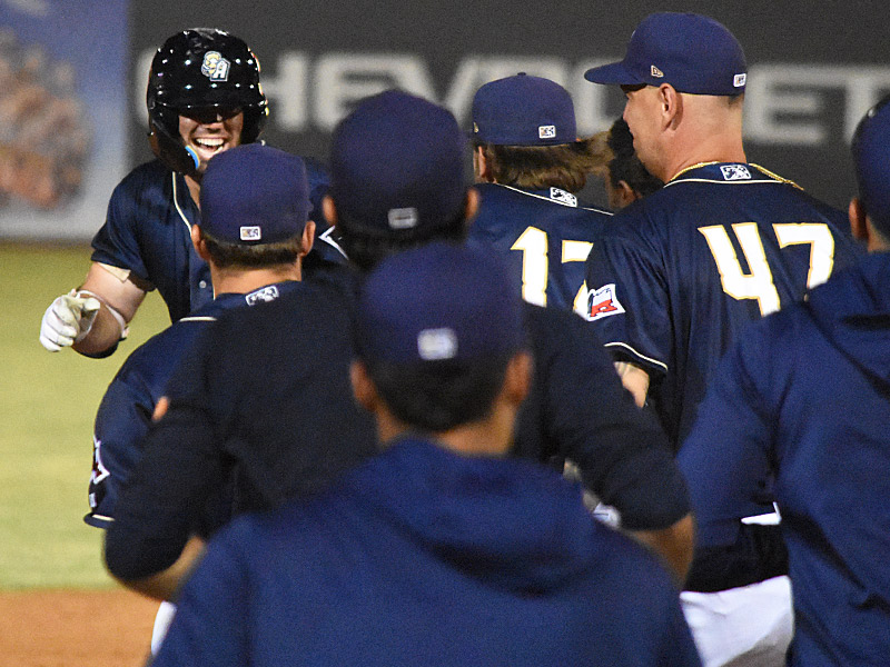 Graham Pauley (top left) celebrates with his teammates after he hit a walk-off single in the bottom of the 10th inning to drive in Ripken Reyes with the winning run in the San Antonio Missions' 6-5 victory over the Amarillo Sod Poodles on Saturday, Aug. 26, 2023, at Wolff Stadium. - photo by Joe Alexander