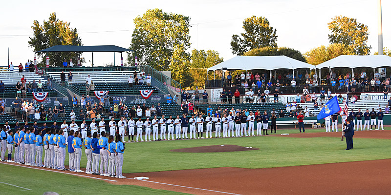 The Missions and Sod Poodles stand on the field for the National Anthem before Thursday's playoff game. The San Antonio Missions lost to the Amarillo Sod Poodles 7-4 on Thursday, Sept. 21, 2023, in Game 2 of the Texas League playoffs at Wolff Stadium. - photo by Joe Alexander