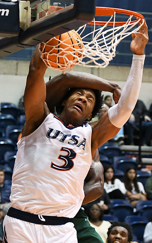UTSA's Trey Edmonds is hit in the head but still finishes off a dunk against Tulane on Jan. 24, 2024, at the Convocation Center. - photo by Joe Alexander